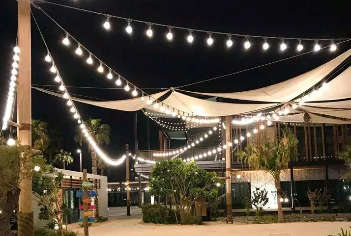 Festoon canopy over an open-air venue