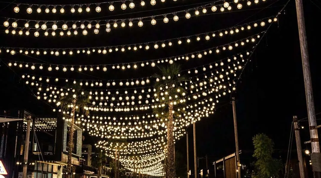 Illuminated string-light canopy at night