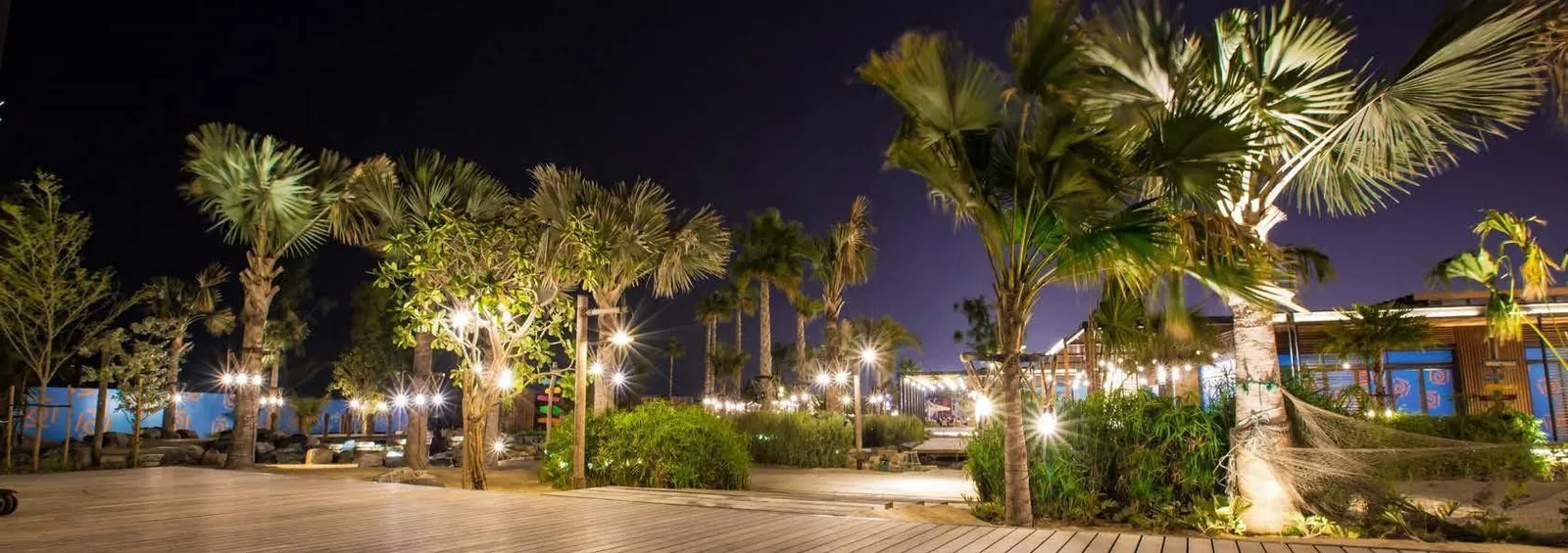 Waterfront promenade lit at night
